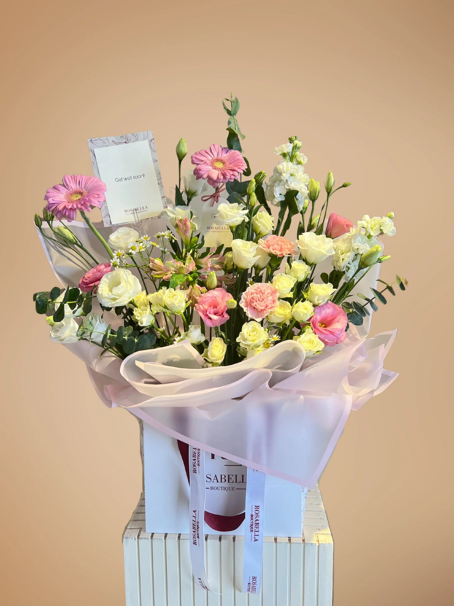 Ballet of Petals Arrangement with soft pink and white flowers in a stylish bag, handcrafted by a flower boutique with flower delivery to Dubai and Sharjah.