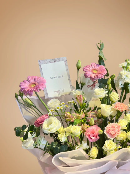 Ballet of Petals Arrangement with soft pink and white flowers in a stylish bag, handcrafted by a flower boutique with flower delivery to Dubai and Sharjah.