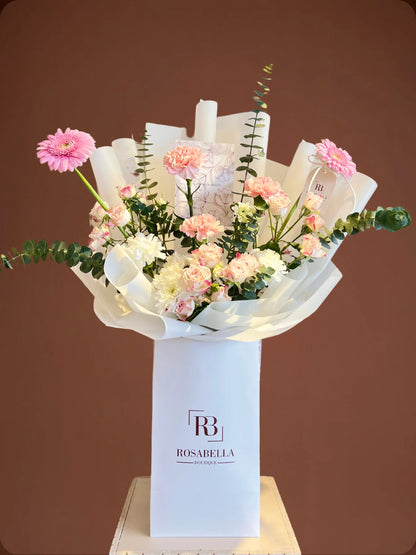 Ballet of Petals Arrangement with soft pink and white flowers in a stylish bag, handcrafted by a flower boutique with flower delivery to Dubai and Sharjah.