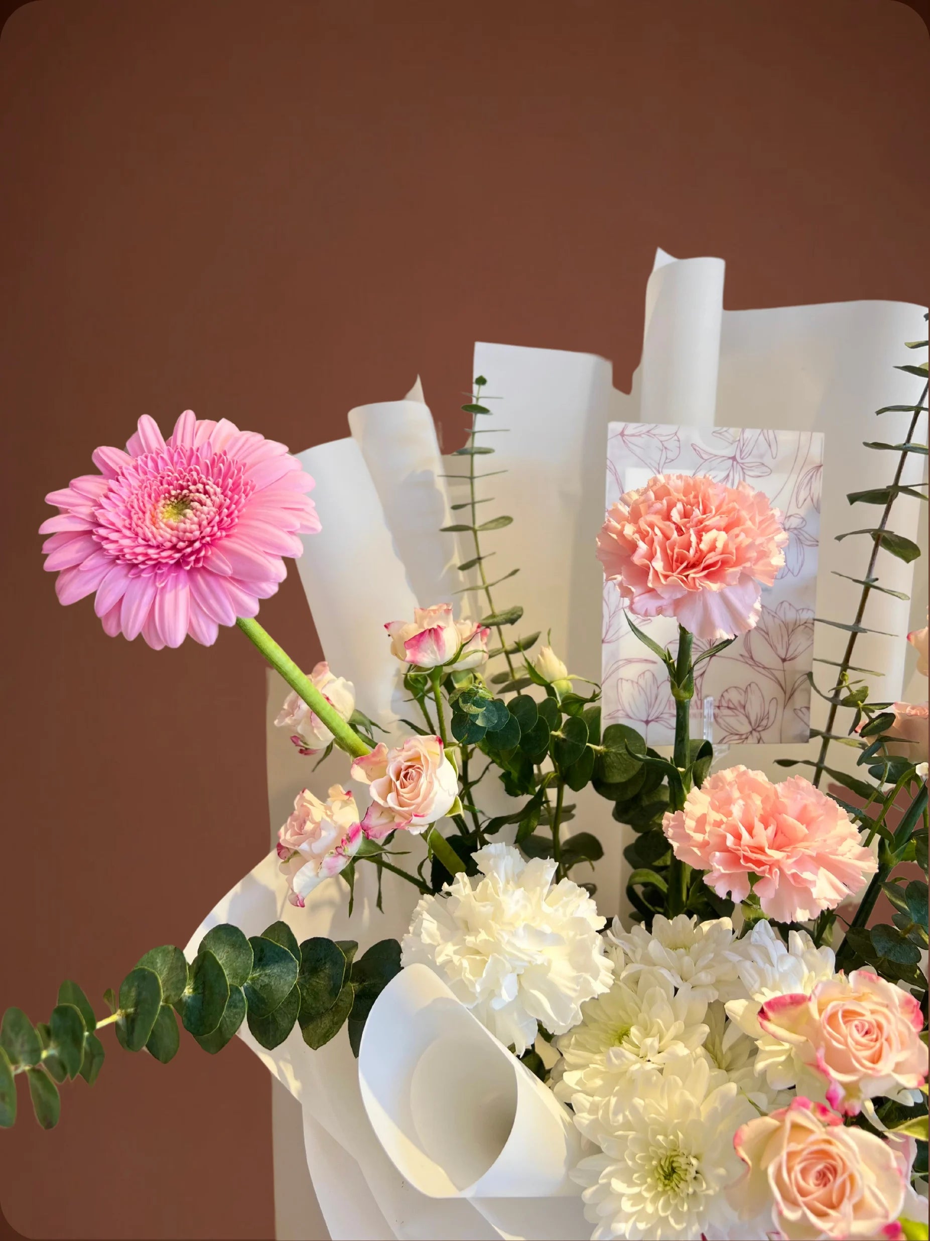 Ballet of Petals Arrangement with soft pink and white flowers in a stylish bag, handcrafted by a flower boutique with flower delivery to Dubai and Sharjah.