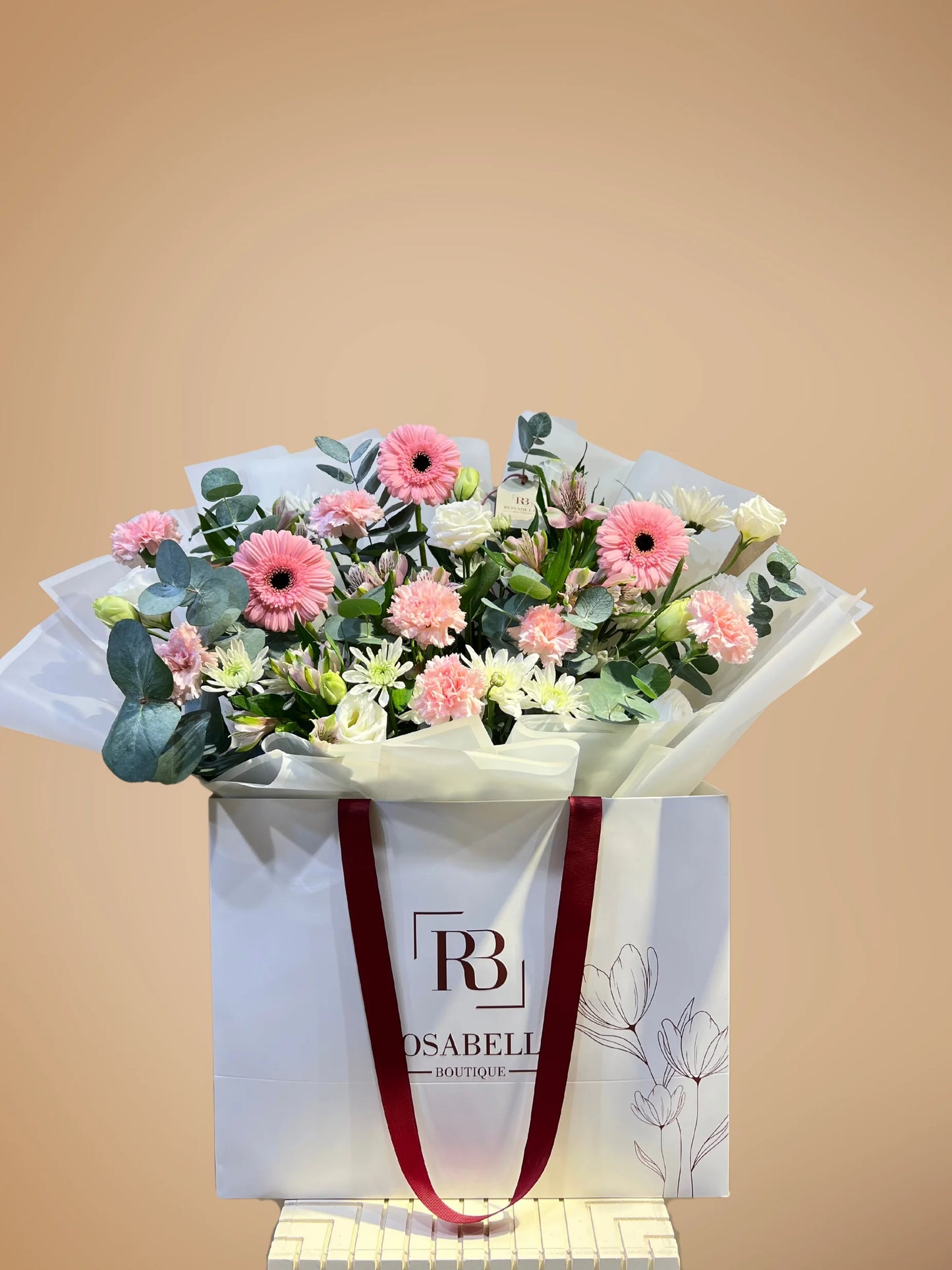 Blossom Paradise bouquet with peach, white, and pink flowers in a spacious bag, available as ready bouquets from a flower boutique with delivery to Dubai and Sharjah.