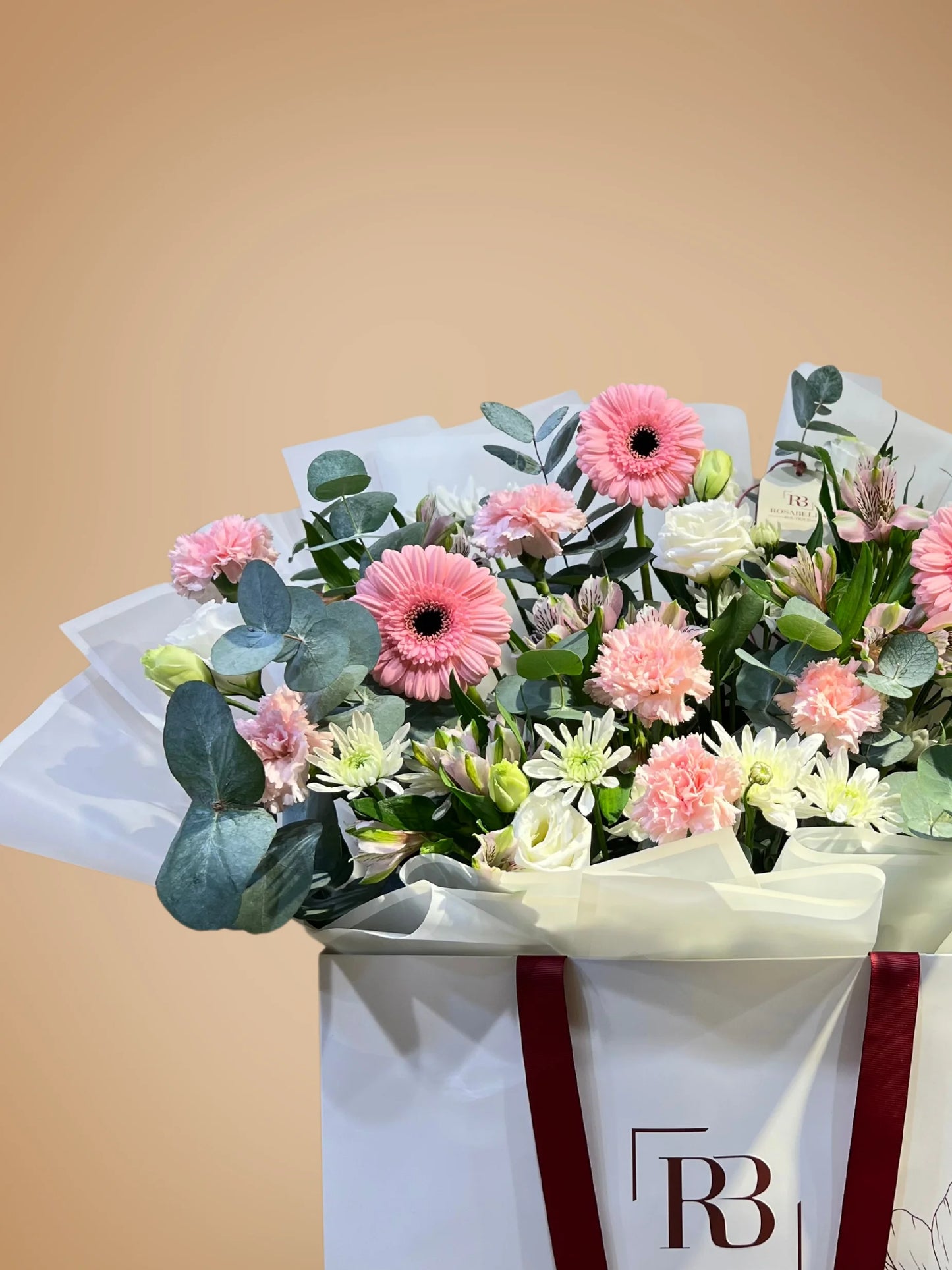 Blossom Paradise bouquet with peach, white, and pink flowers in a spacious bag, available as ready bouquets from a flower boutique with delivery to Dubai and Sharjah.