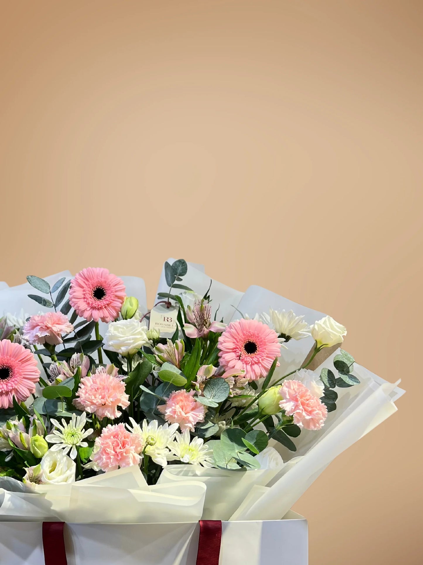 Blossom Paradise bouquet with peach, white, and pink flowers in a spacious bag, available as ready bouquets from a flower boutique with delivery to Dubai and Sharjah.