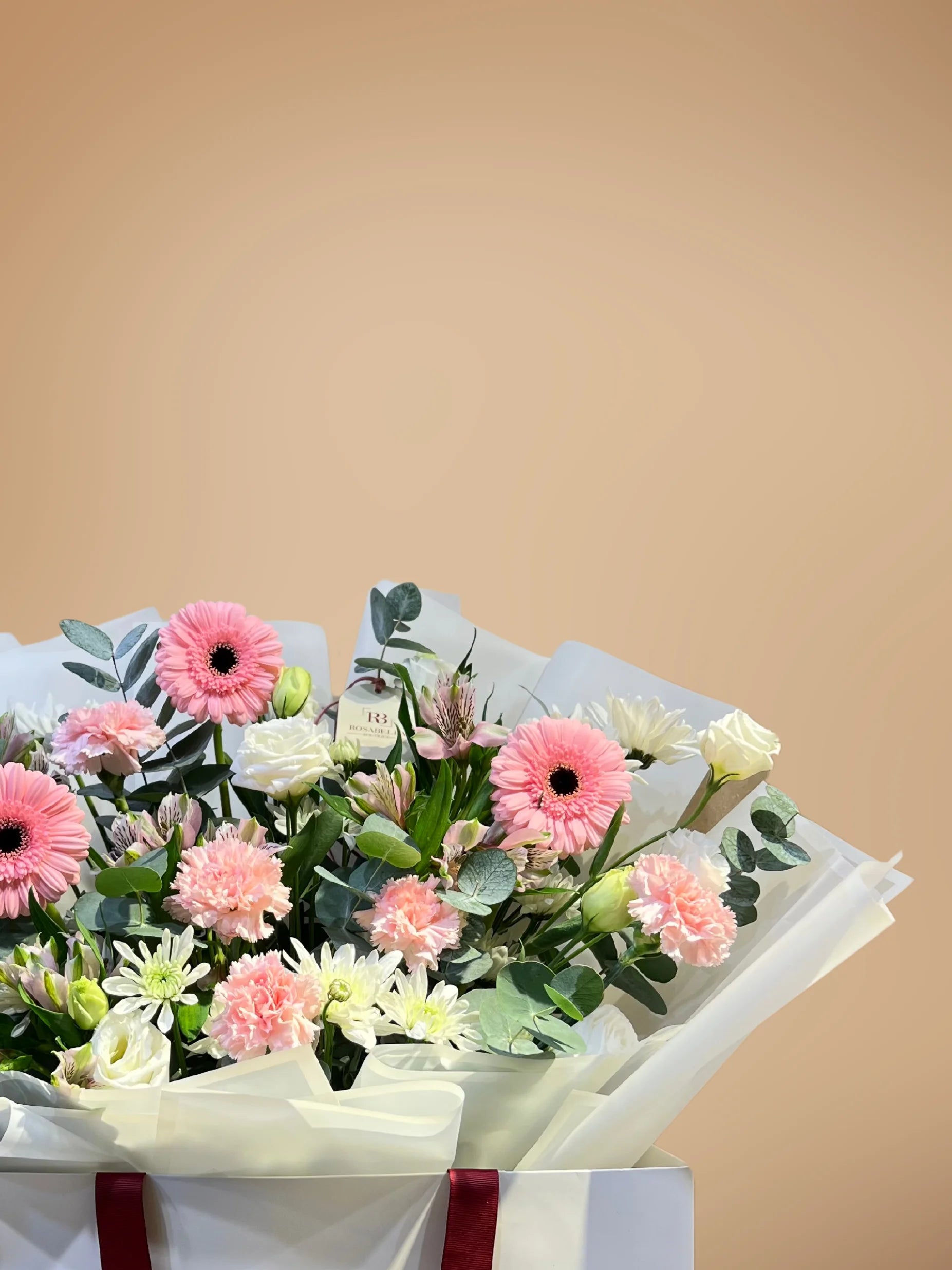 Blossom Paradise bouquet with peach, white, and pink flowers in a spacious bag, available as ready bouquets from a flower boutique with delivery to Dubai and Sharjah.