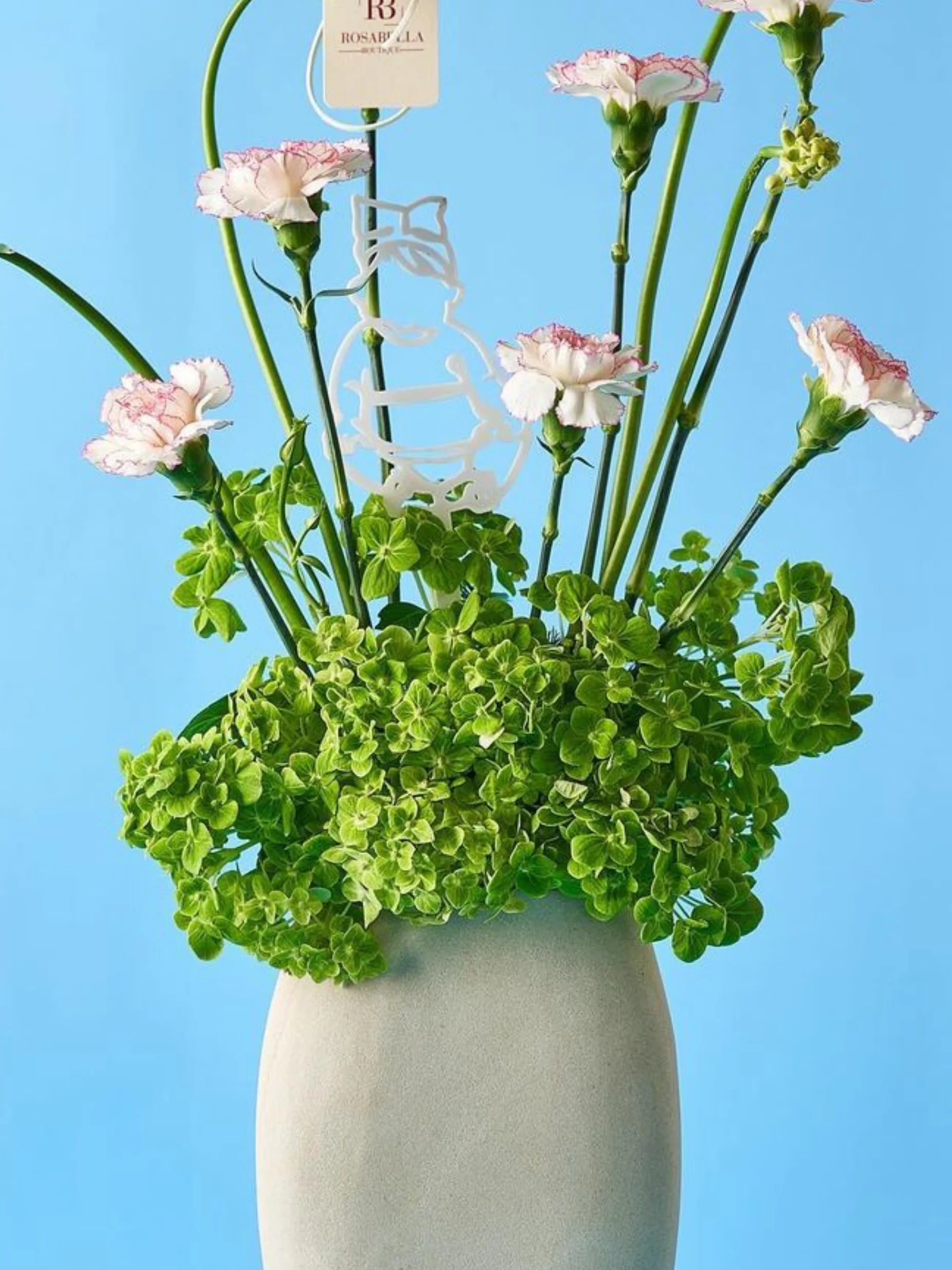 Little Wonder Vase Arrangement with delicate pink blooms and lush greens in a tall vase, crafted by Rosabella Boutique with flower delivery available to Dubai and Sharjah.