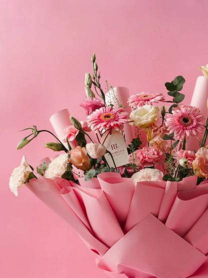 Petal Cascade Bouquet with cascading pink blooms, crafted for special celebrations and available as birthday flowers with delivery to Dubai, Sharjah, and Muwaileh.