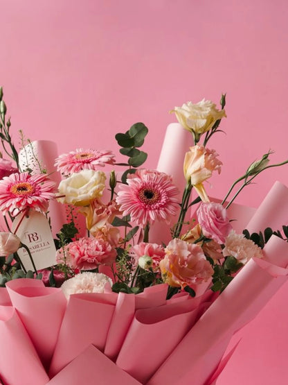 Petal Cascade Bouquet with cascading pink blooms, crafted for special celebrations and available as birthday flowers with delivery to Dubai, Sharjah, and Muwaileh.