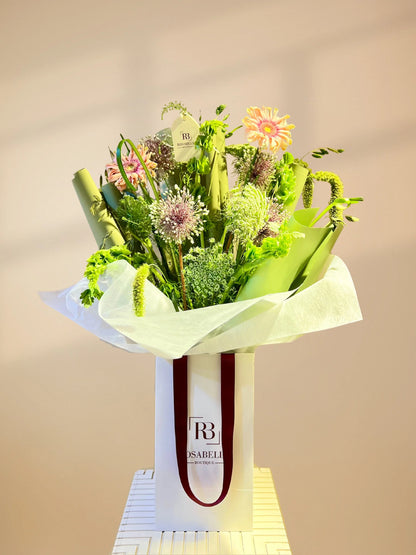 Tall Bloom Handbag Arrangement with tall, elegant flowers in a chic handbag design, available as special flowers with delivery to Dubai, Sharjah, and Muwaileh.