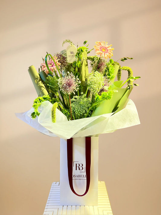 Tall Bloom Handbag Arrangement with tall, elegant flowers in a chic handbag design, available as special flowers with delivery to Dubai, Sharjah, and Muwaileh.