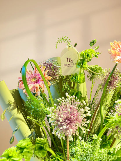 Tall Bloom Handbag Arrangement with tall, elegant flowers in a chic handbag design, available as special flowers with delivery to Dubai, Sharjah, and Muwaileh.