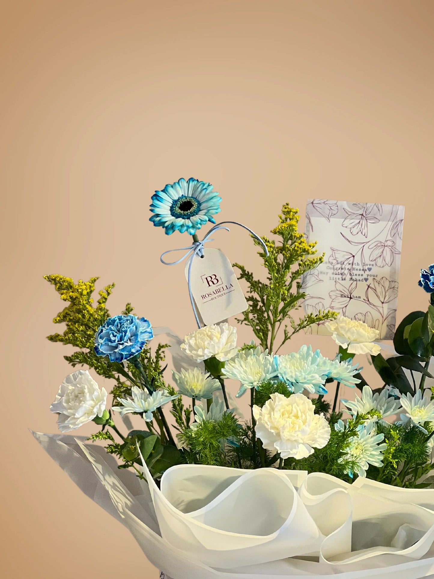 Whispering Blues Handbag Arrangement with blue and white blooms in a chic handbag, available at a flower shop in Muwaileh with delivery to Dubai and Sharjah.